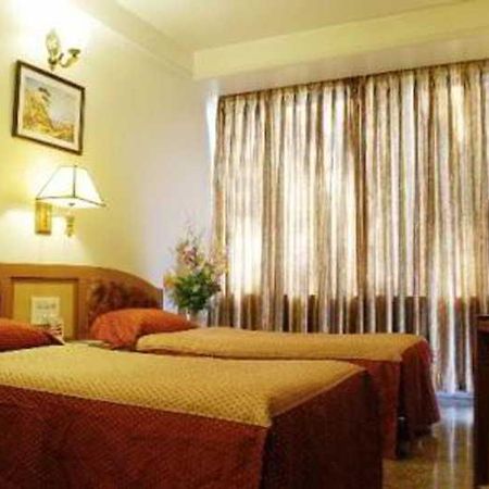 Hotel Mandakini Ambience Poona Kamer foto